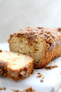A loaf of this streusel topped gluten–free banana bread is a winning gift for friends and family! Made with ripe bananas, maple syrup, gluten-free flour and a buttery walnut topping!